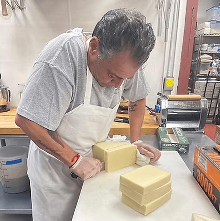 Chef Gianfranco preparing fresh mozzarella by hand